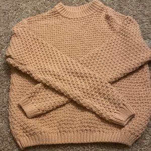Light pink sweater.